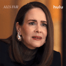 a close up of a woman 's face with the words all 's fair on the bottom