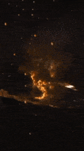 a close up of a fireball with sparks coming out of it