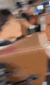 a blurry photo of people sitting at tables in a restaurant