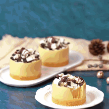 three desserts on a white plate with one missing a bite