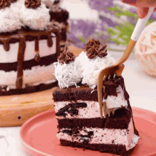 a piece of cake on a pink plate with a fork