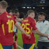 a group of soccer players on a field with one wearing the number 10