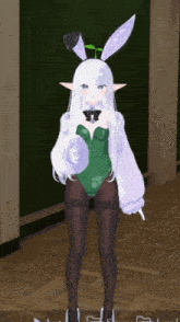 a girl with white hair is wearing a green bunny outfit
