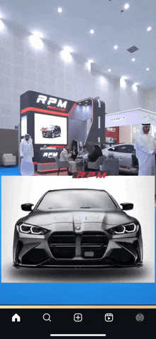 a picture of a car next to a booth that says rpm on it