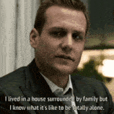 a man in a suit and tie says i lived in a house surrounded by family but