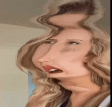 a close up of a woman 's face with a strange face