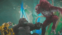 a statue of a gorilla and a statue of a robot fighting