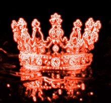 a red crown with a black background and a reflection