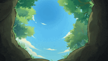 looking out of a cave into a blue sky with clouds