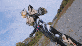 a person in a robot costume stands in a field