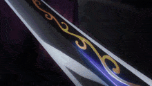 a person is holding a sword with a purple and gold design on the blade
