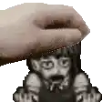a hand is touching a pixelated image of a man with a beard .
