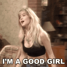 a woman in a black crop top says " i 'm a good girl "