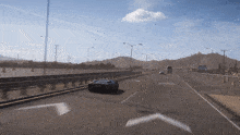 a car is driving down a highway with an arrow pointing right