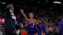 a female basketball player with the number 0 on her uniform
