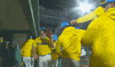 a group of boston baseball players are huddled together in the dugout