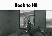 a person is holding a gun in a video game and the words `` rook to h8 '' are on the screen .