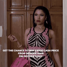 a woman in a zebra print dress holding a pink bag
