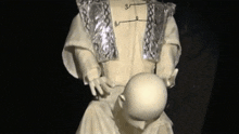a statue of a person holding a baby in their arms