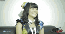 a girl is sitting on a couch with the words jkt46 story written on the bottom