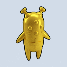 a gold cartoon character with a cross on his chest
