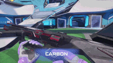 a person is holding a gun with the word carbon on the bottom