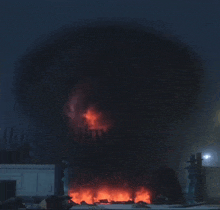 a giant robot with a red light coming out of its head