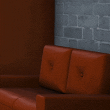 a cartoon character wearing a hat and bow tie is sitting on a couch