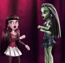 two monster high dolls are standing next to each other on a stage and talking to each other .