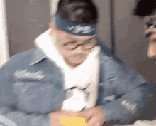 a blurry picture of a man wearing a blue headband