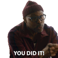 a man wearing glasses and a beanie is saying you did it