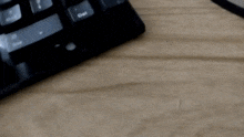 a close up of a keyboard with the enter key highlighted