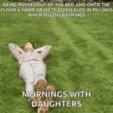 a woman laying on the grass with a caption that says mornings with daughters