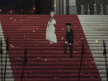 a woman in a white dress stands next to a man in a black uniform on a set of stairs