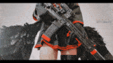 a woman holding a gun with a red stripe on the barrel