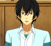 a drawing of a man with black hair and a blue shirt