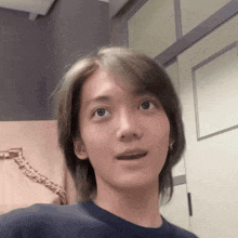 a close up of a person 's face with a skeleton in the background