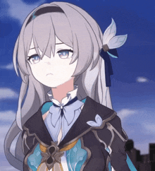 a girl with long grey hair and blue eyes is wearing a black and blue outfit