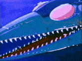 a close up of a shark 's mouth with a pink eye