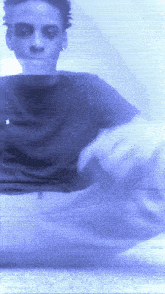 a blurry picture of a person 's face with a blue background