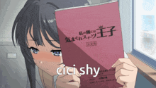 a girl holding a book that says " cici shy " on it