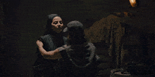 a man wearing a baseball cap is hugging another man
