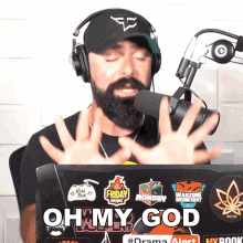 a man wearing headphones stands in front of a microphone with the words oh my god on the screen