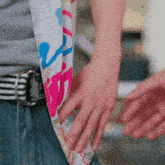 a person wearing a belt and a scarf with a butterfly on it