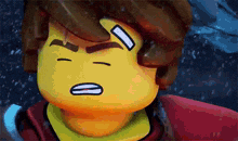 a close up of a lego character 's face with a sad look on his face