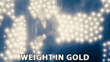 Weight In Gold Worth GIF - Weight In Gold Worth Value GIFs