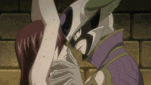a man in a mask holds a woman 's arm