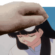 a close up of a person 's hand touching a girl 's head .