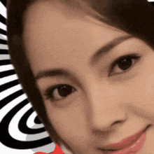 a close up of a woman 's face with an optical illusion behind her