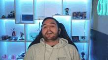 a man with a beard wearing a hoodie that says the carbon co